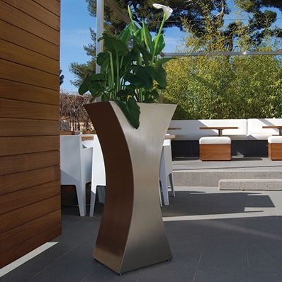 MISS FLOWER stainless steel planter for commercial or restaurant enhancement designed by CYRIA, publisher of outdoor furniture.
