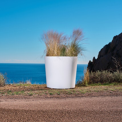 Create islands of greenery in public spaces with GLAM round metal pots from street furniture manufacturer CYRIA.